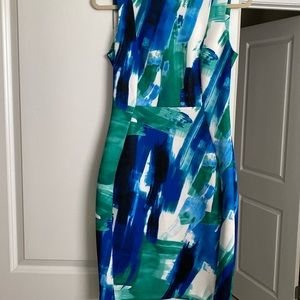 Beautiful scuba dress for any occasion. never worn. 92% Polyester 8% Spandex.